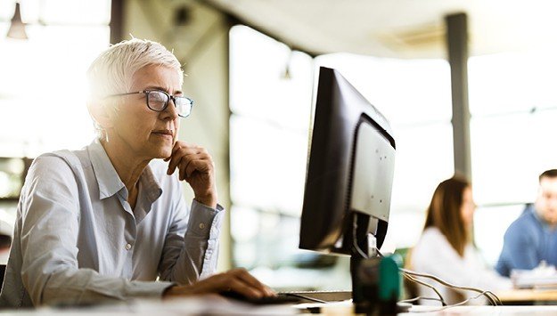 woman analyzing AML compliance program